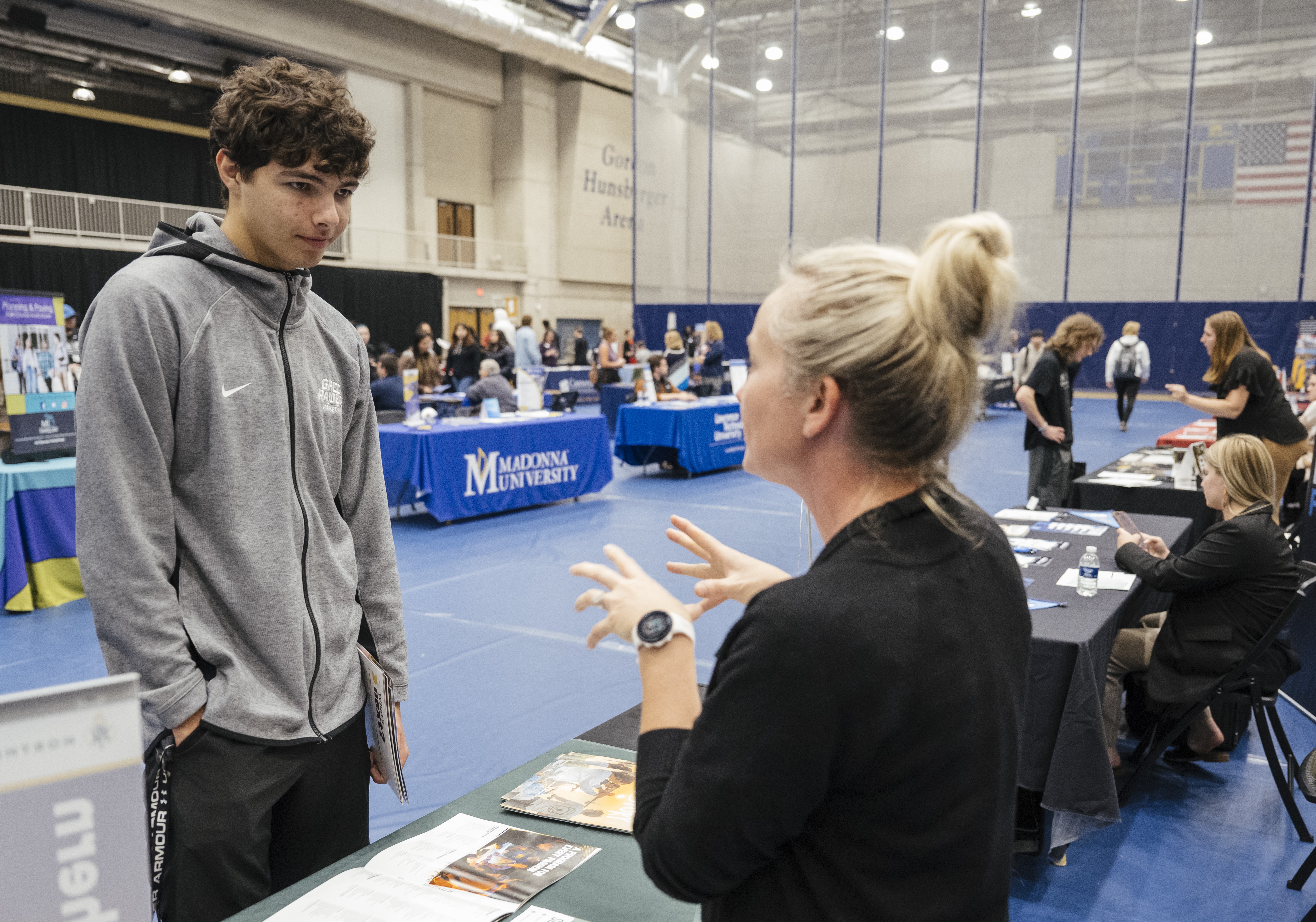 GRCC Student talking with a University Rep at the Transfer Fair